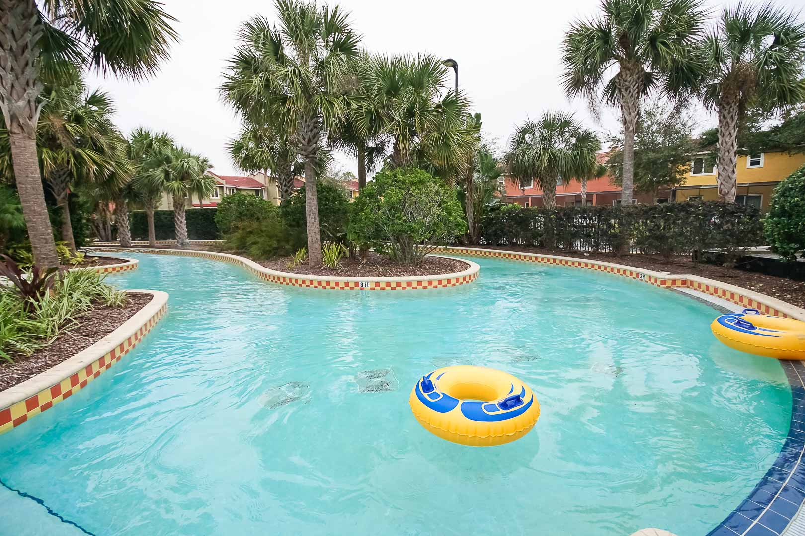 An outdoor lazy river pool at VRI's Fantasy World Resort in Florida.